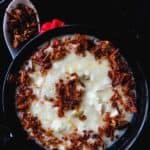 Sri Lankan rice and chicken congee- cooked in chicken broth, garlic and coconut milk, this kanji is a favorite among Muslims for iftar and a hearty morning breakfast for big families. serve with a seasoned, deep-fried crispy onion, garlic topping and enjoy-islandsmile.org