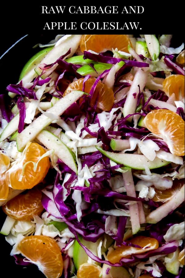 Raw cabbage and apple coleslaw with orange-honey vinaigrette- a crunchy vegan, vegetarian, gluten-free, easy salad that's not only healthy but makes a lovely colorful addition to your table. my kids loved it and hopefully, yours will too.