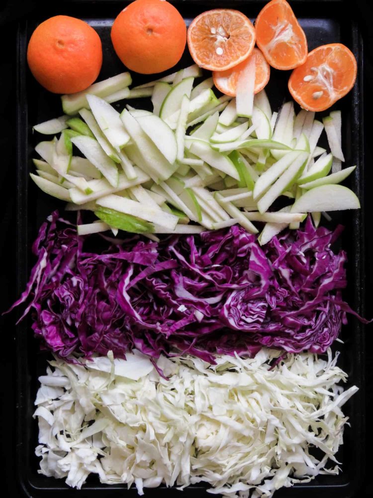 Raw cabbage and apple coleslaw- a crunchy vegan, vegetarian, gluten-free, easy salad that's not only healthy but makes a lovely colorful healthy addition to your table. my kids loved it and hopefully, yours will too.-islandsmile.org