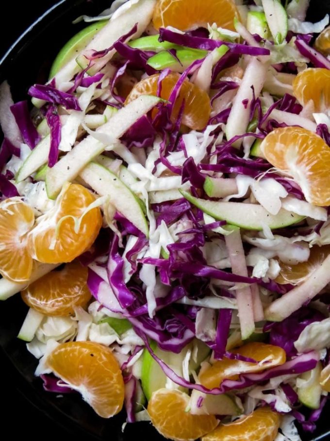 Raw cabbage and apple coleslaw- a crunchy vegan, vegetarian, gluten-free, easy salad that's not only healthy but makes a lovely colorful healthy addition to your table. my kids loved it and hopefully, yours will too.