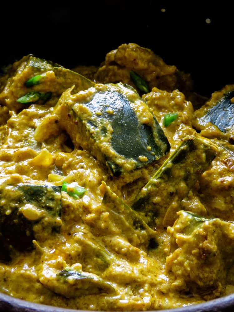 Sri Lankan pumpkin curry in roasted coconut also known as "kalu pol wattakka", a much more creamier, thicker pumpkin curry than what you'll be accustomed to, try it.