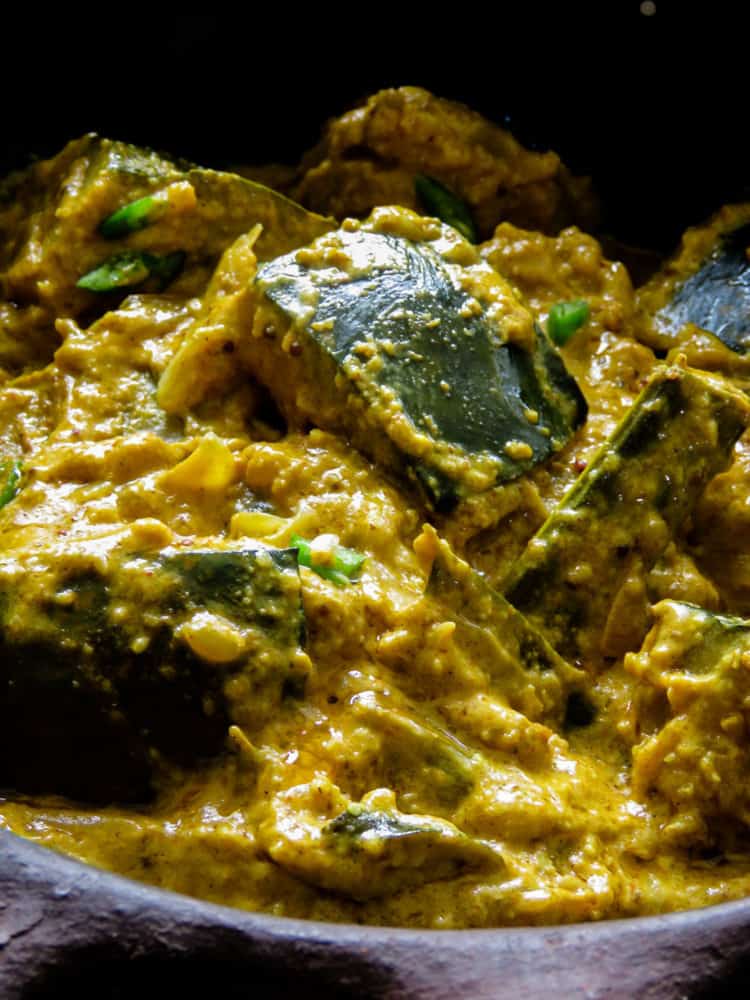 Sri Lankan pumpkin curry in roasted coconut also known as "kalu pol wattakka", a much more creamier, thicker pumpkin curry than what you'll be accustomed to, try it.