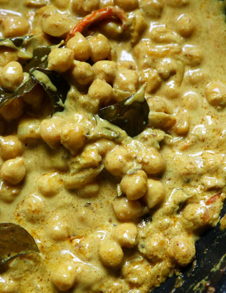 creamy chickpea curry in with spices, coconut milk and spices.