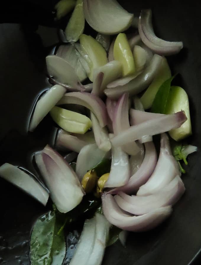 tempering onions for the mushroom curry.