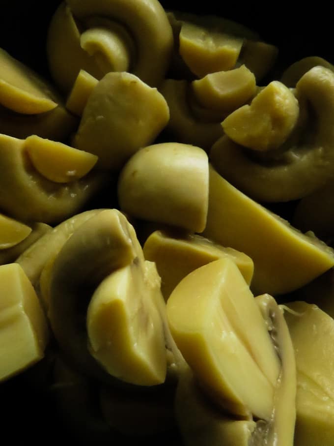 drained and halved mushrooms for the mushroom curry.