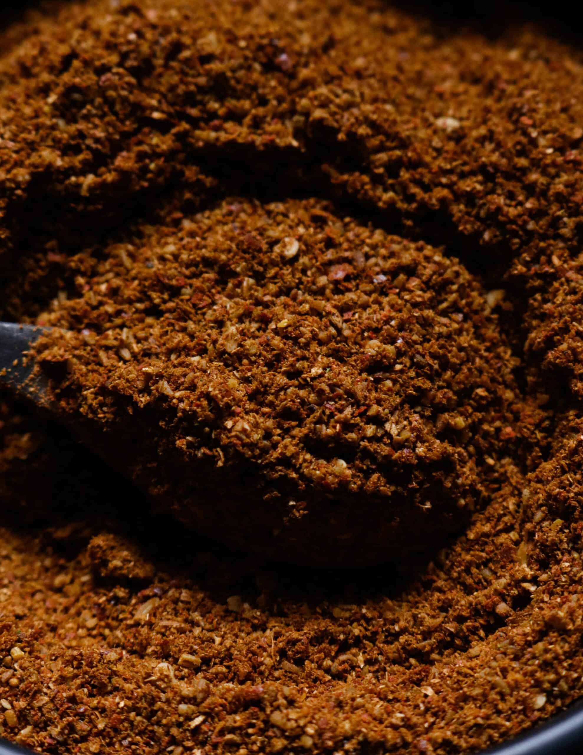 jaffna curry powder scooped with a spoon.