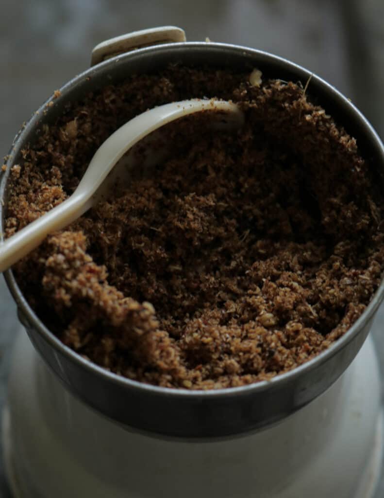 minced spices in a grinder to make chettinad chicken