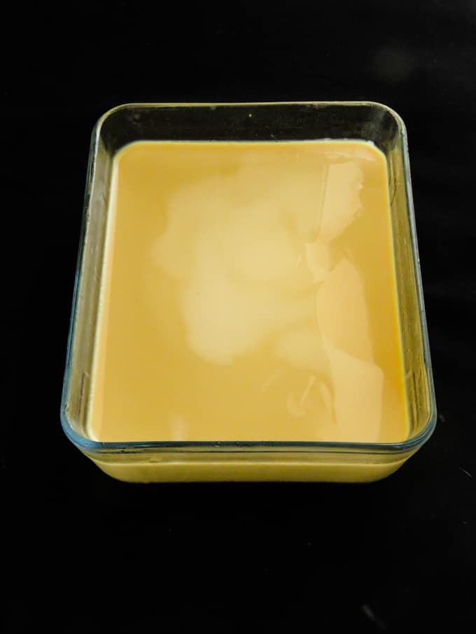 custard mix poured into a pyrex dish.