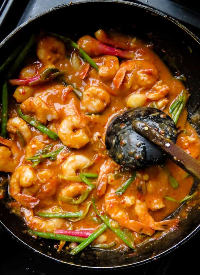 sriracha shrimp with coconut milk sauce cooked in a skillet