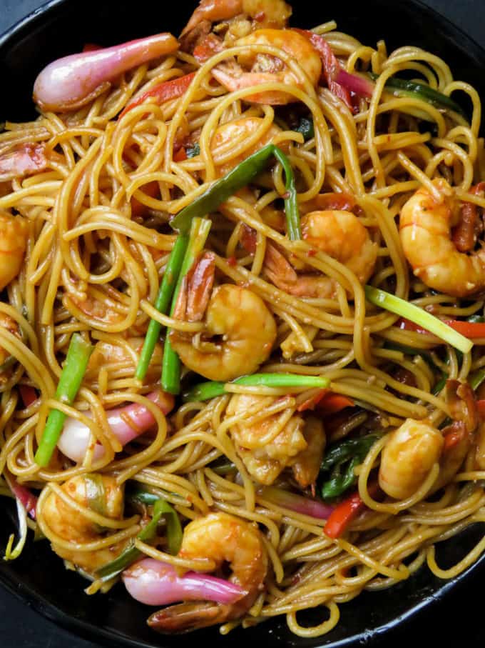 Sriracha shrimp stir-fry noodles, an amazingly easy two in one recipe that fixes your need for a spicy seafood dish that turns into a simple one-pot dinner.#shrimp #sriracha #seafood #pescatarian #food #dinner #onepot #glutenfree #noodles.