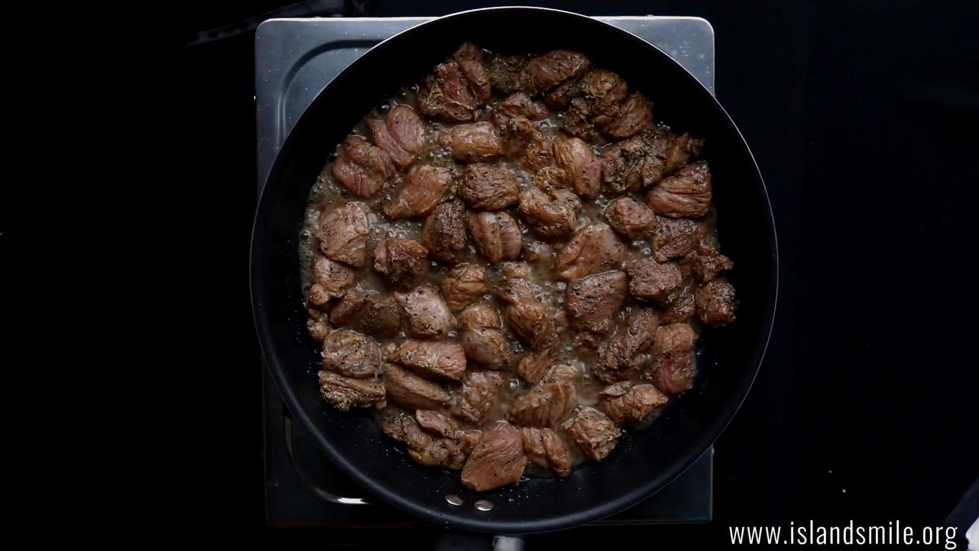 cooking the sliced beef until the liquid evaporates for devilled beef.