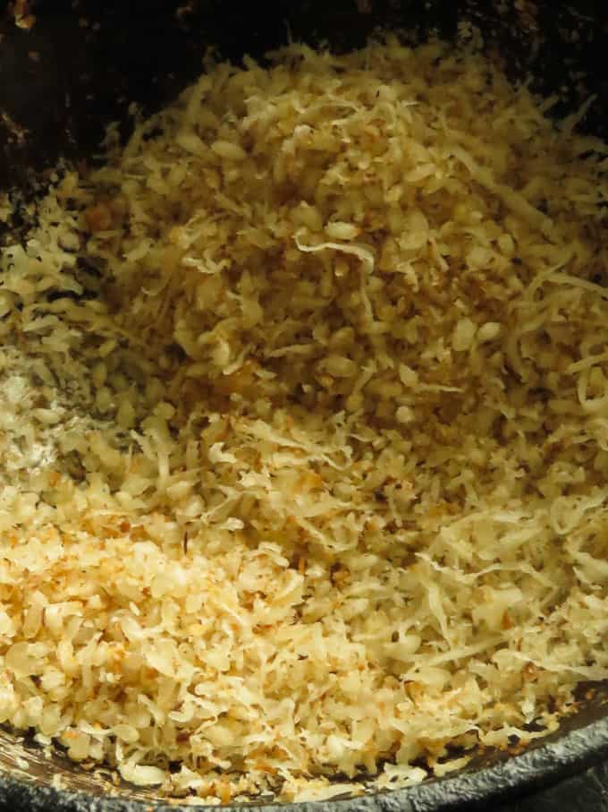 toasting the raw rice and coconut flakes.