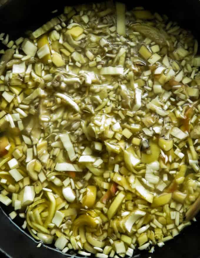 chopped banan flower blossom soaked in a bowl of water to m ake the banana blossom recipe.