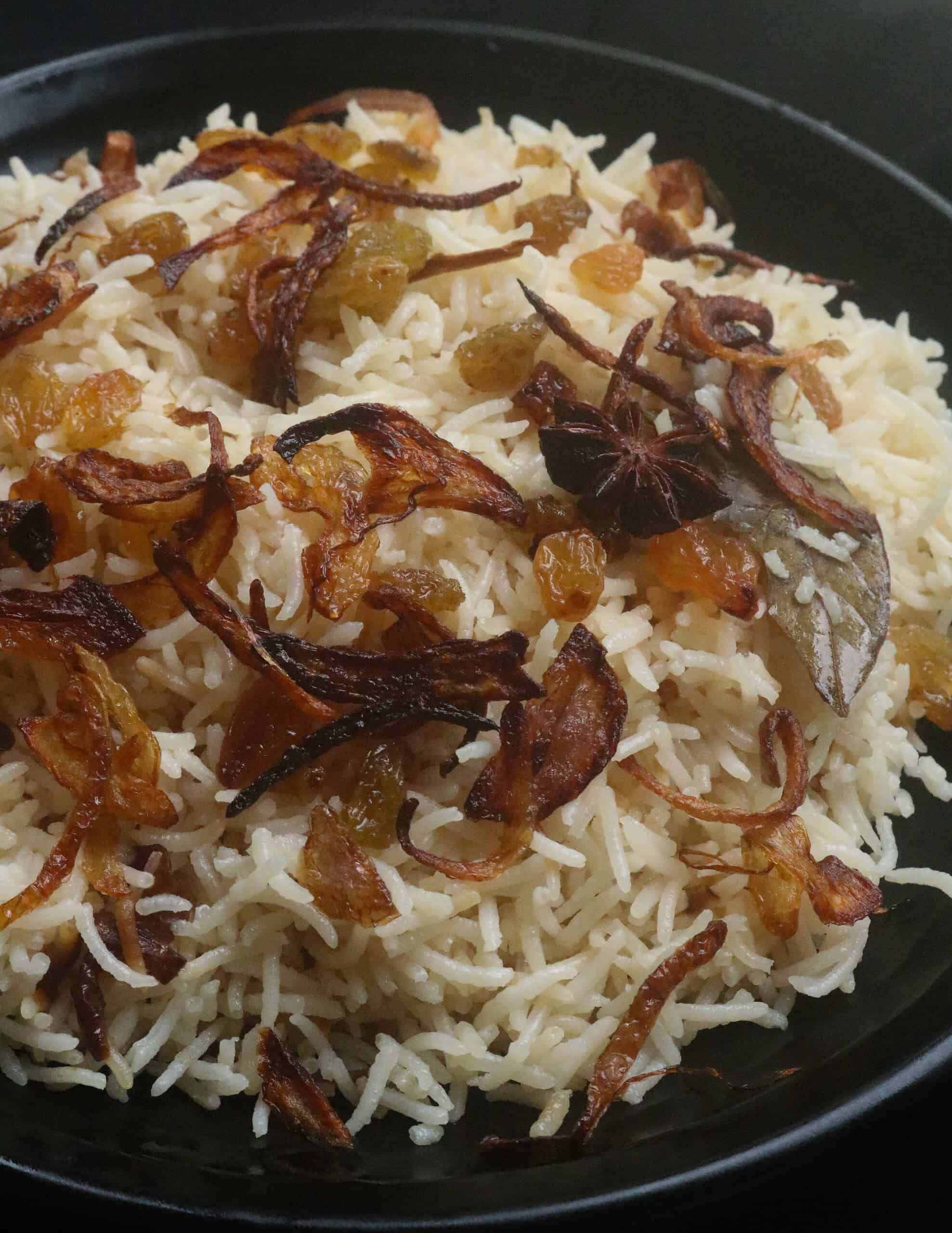 ghee rice cooked with basmati rice with fried onions and raisins.