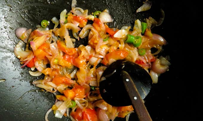Continue cooking the ingredients in the wok over medium heat