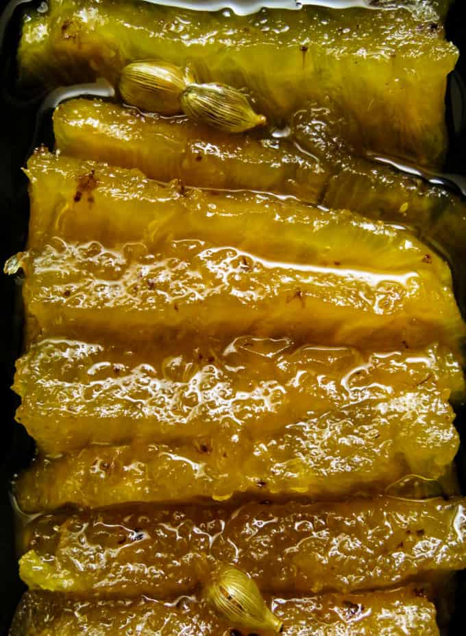 Cooked Pineapple in aromatic sugar syrup.