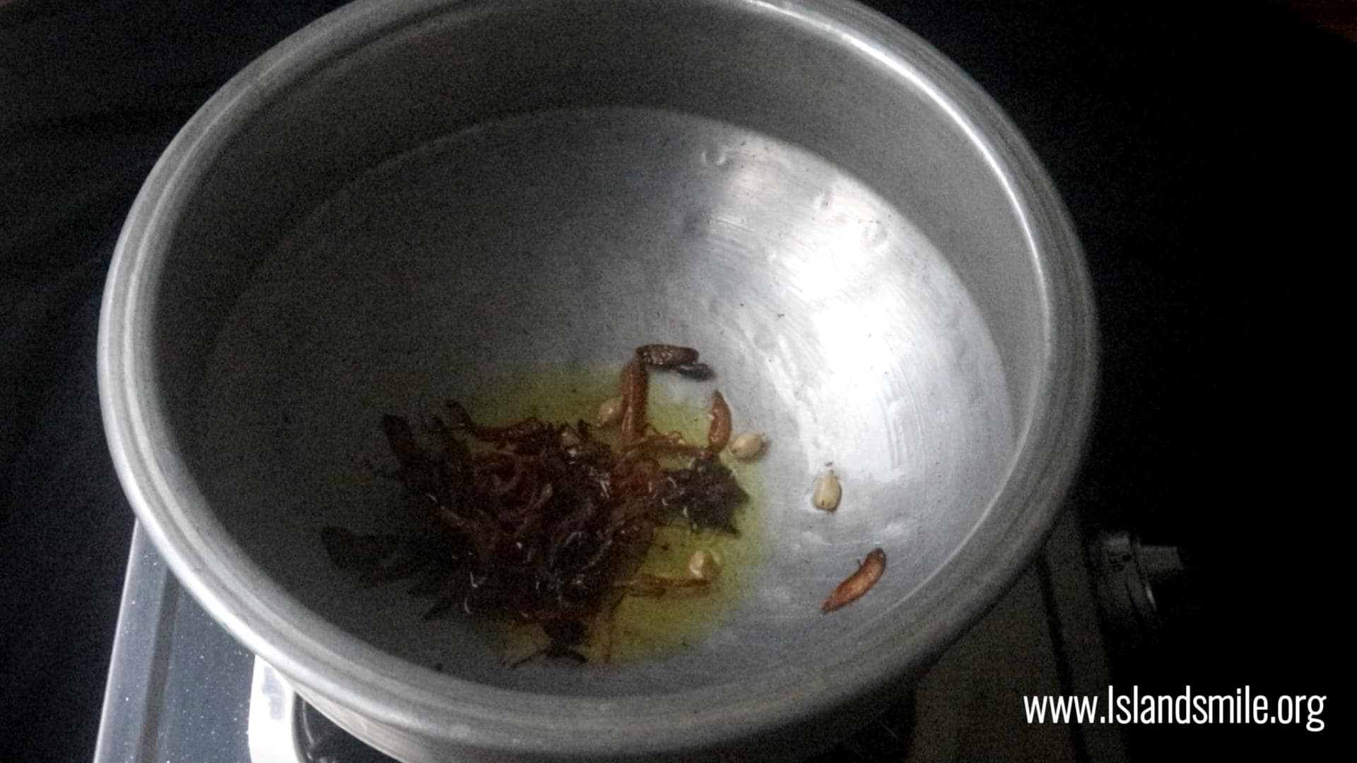 cooking the aromatics in ghee to cook the ghee rice