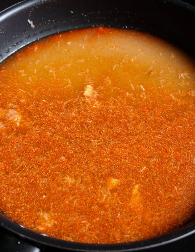 cooking the vinaigrette to make the date and lime chutney