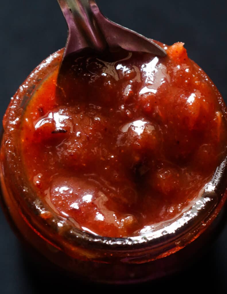 date and lime chutney stored in a bottle.