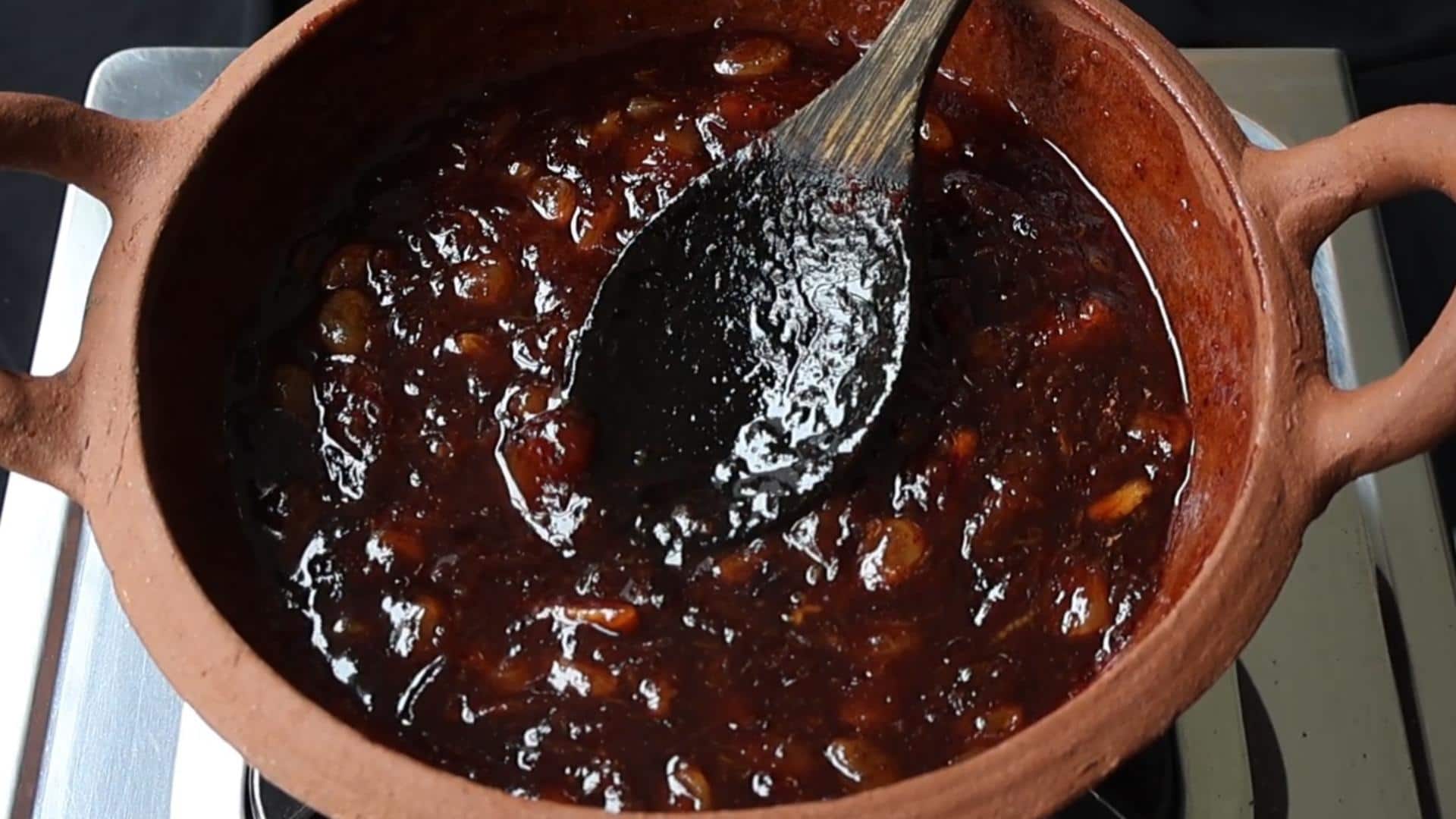 thick date and lime chutney crushed using a wooden spoon.