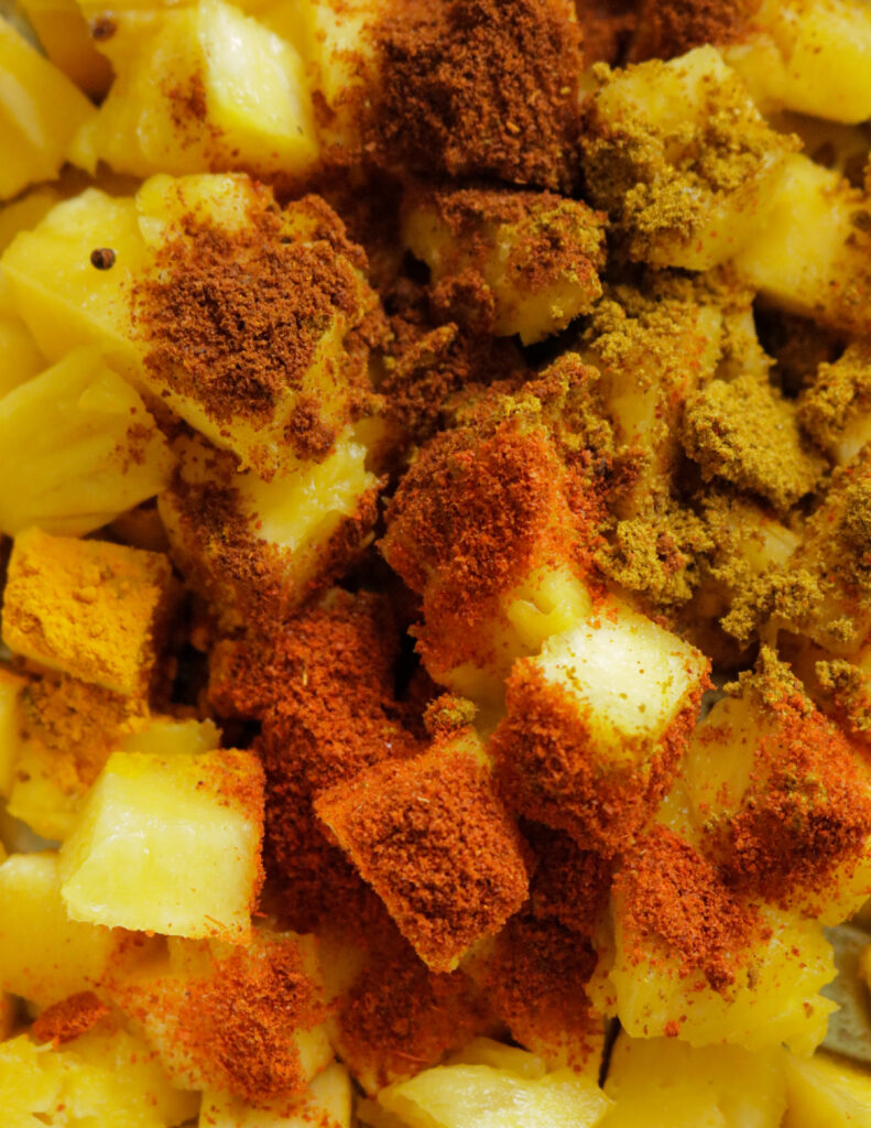 curry powder, red chilli powder added to pineapple cubes.