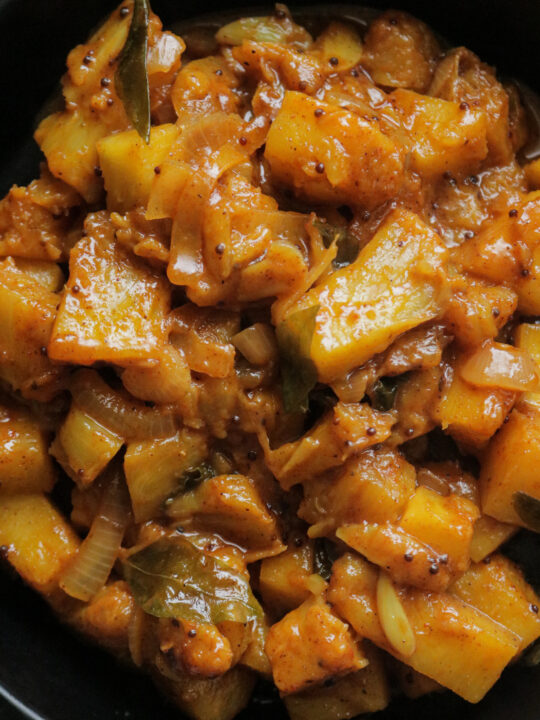 spicy pineapple curry added in a bowl.