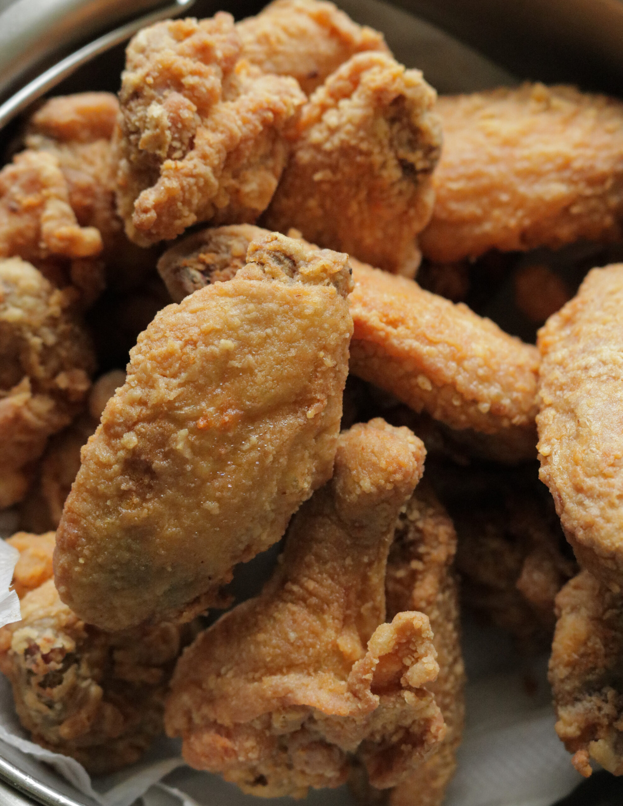 spicy pan fried chicken wings in teriyaki sauce. ISLAND SMILE