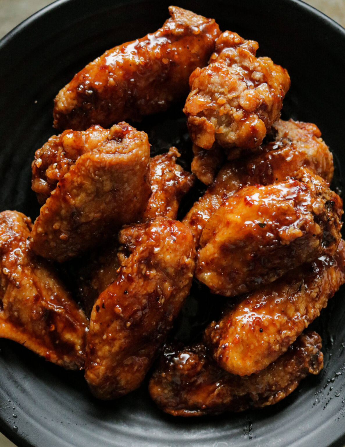 spicy pan fried chicken wings in teriyaki sauce. ISLAND SMILE