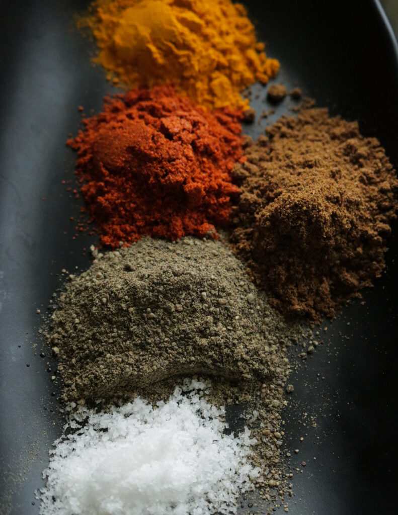 red chilli powder, curry powder, pepper powder and salt ready to use for calamari curry.