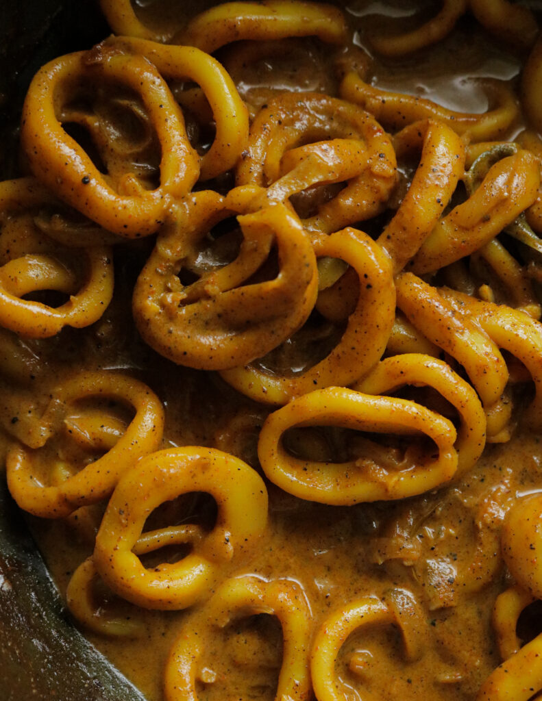 rings of squid turned to a squid curry with gravy covered in it.