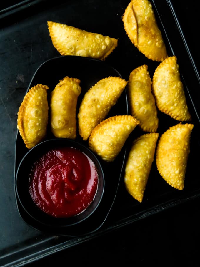 Deep fried-Sri Lankan curried fish patties. A step-by-step guide on how to make these savory Sri Lankan snacks at home.