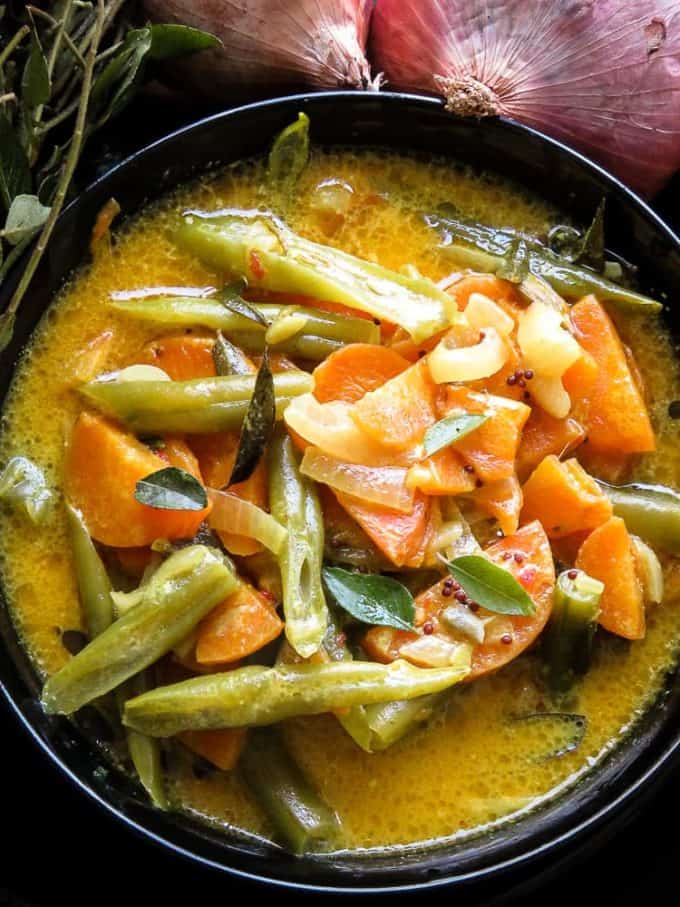 Creamy carrot and bean curry in a bowl. find the recipe at islandsmile.org