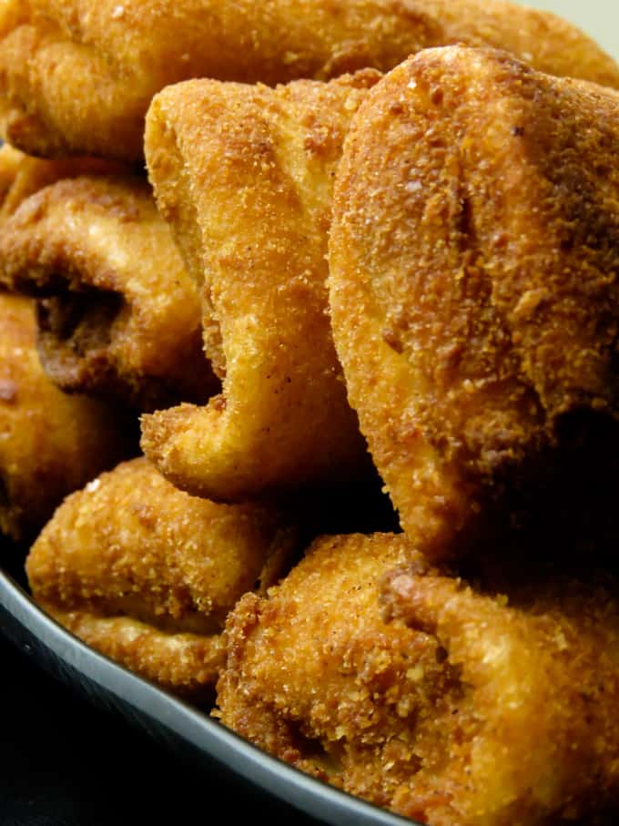 A plate of crispy chinese fish rolls .