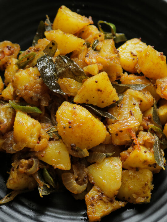 served bombay potatoes in a platter