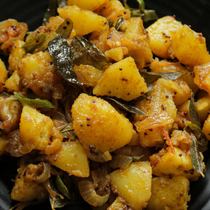 served bombay potatoes in a platter