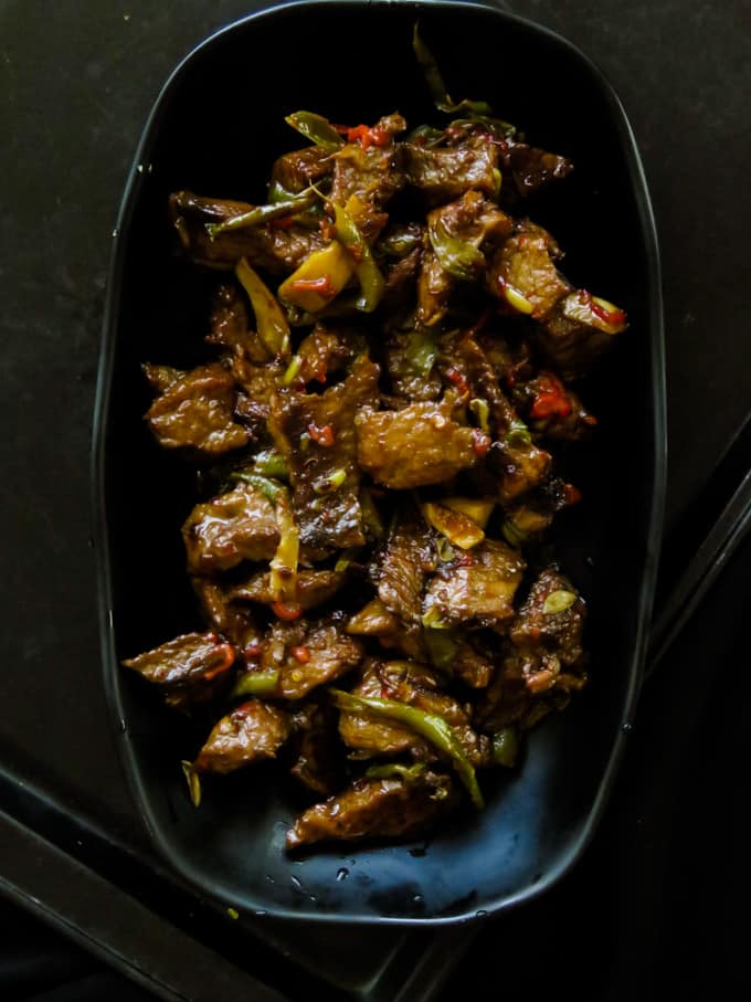 crispy beef stir fry in ginger-pepper sauce. Soy sauce marinated beef slices, fried until they turn crispy then cooked in ginger-pepper sauce to give you a tasty beef stir fry to enjoy with a bowl of rice or noodles.