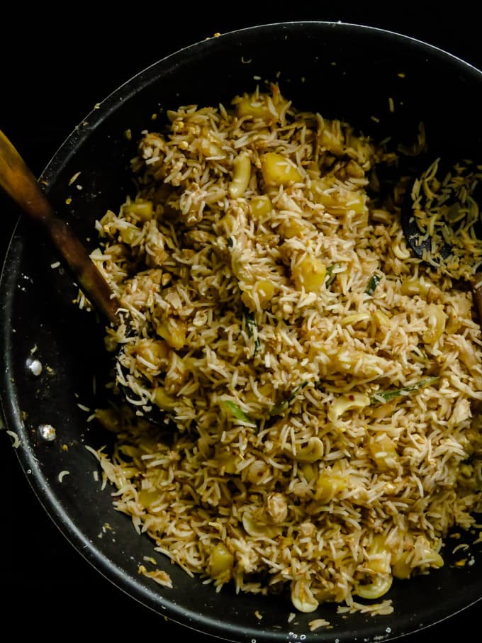 Pineapple chicken fried rice(one-pot meals). Chicken and PIneapple are stir-fried in spices then mixed together with rice to create both a budget-friendly and time- saving one-pot meal.