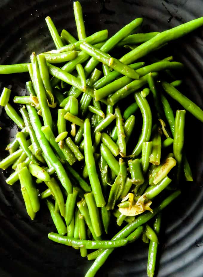 green beans-garlic stir-fried in browned butter. Make the easiest holiday side-dish using fresh green beans or even frozen fine beans to make this 3 ingredient stir-fry.  Holidays, parties and family get together's can be a stressful time to make food while enjoying the whole cooking thing.