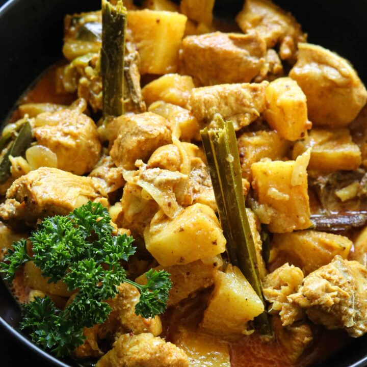 pineapple chicken curry served in a bowl.