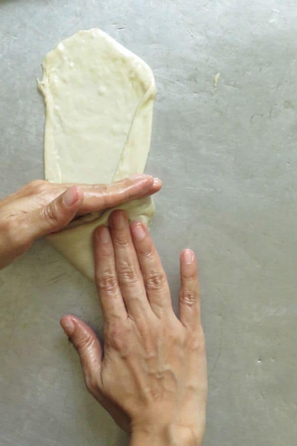 how to shape the triangle vegetable roti as you fold. find recipe on islandsmile.org