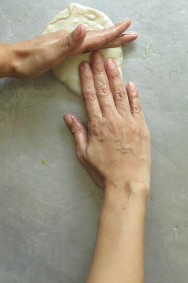 continue to shape and fold the triangle vegetable roti.