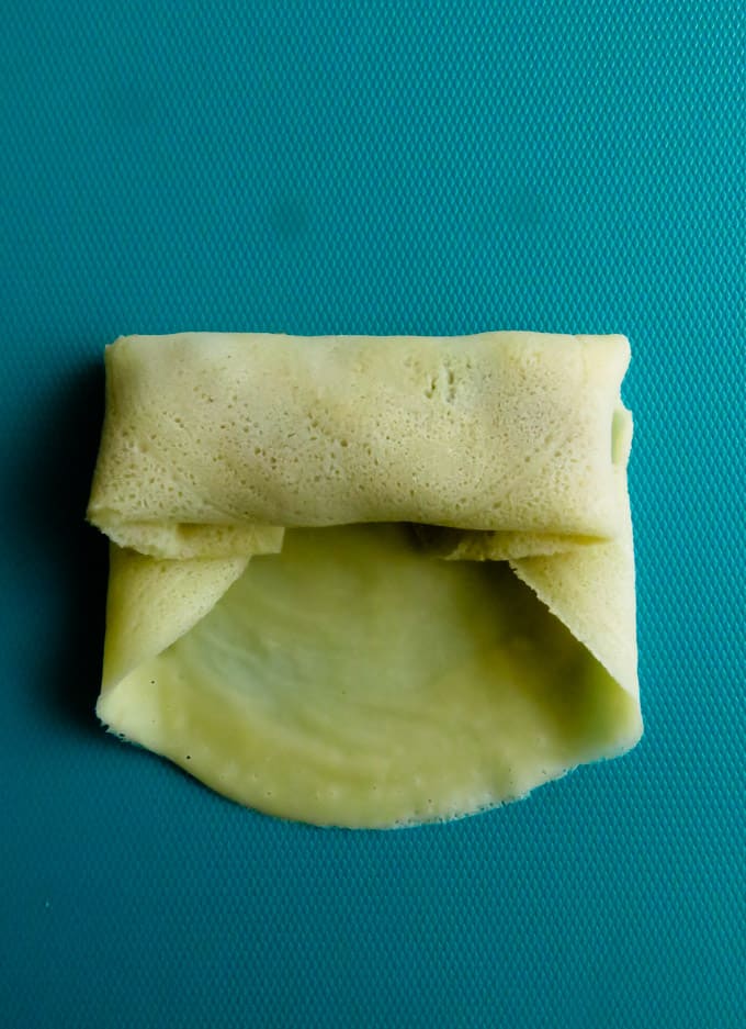 roll the fish roll pancake from the bottom and seal tight.
