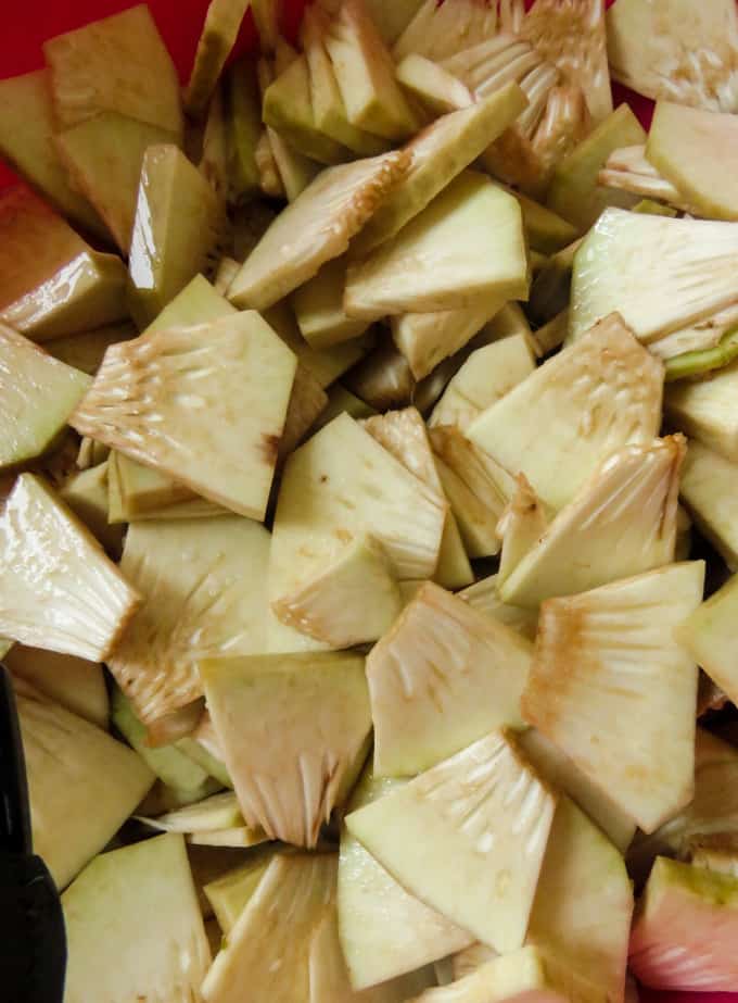 rinsing the breadfruit chips in turmeric water.