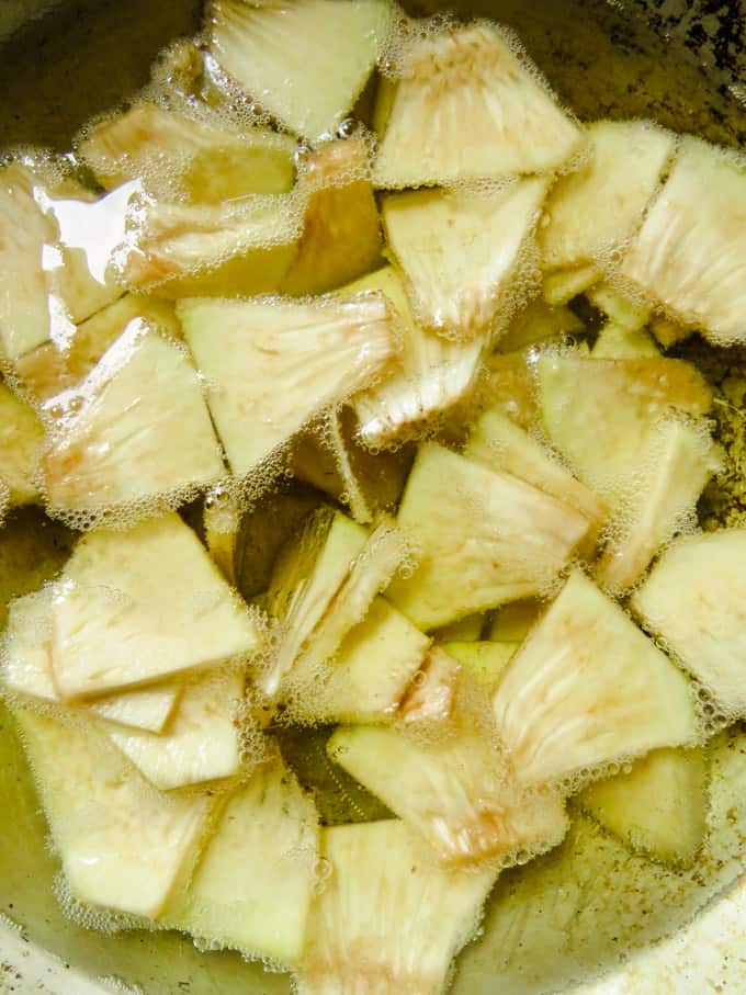 deep frying the breadfruit chips.