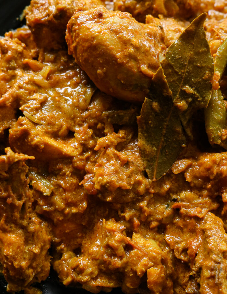 thick chicken curry cooked with yoghurt and tomato.