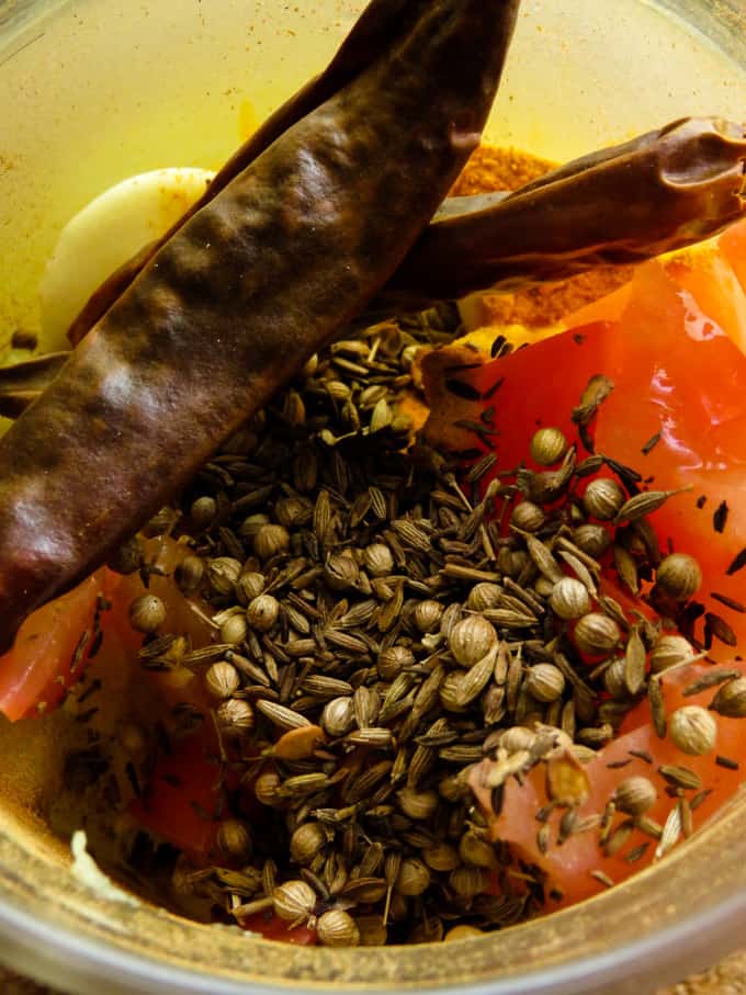 grinding the spices for the korma.