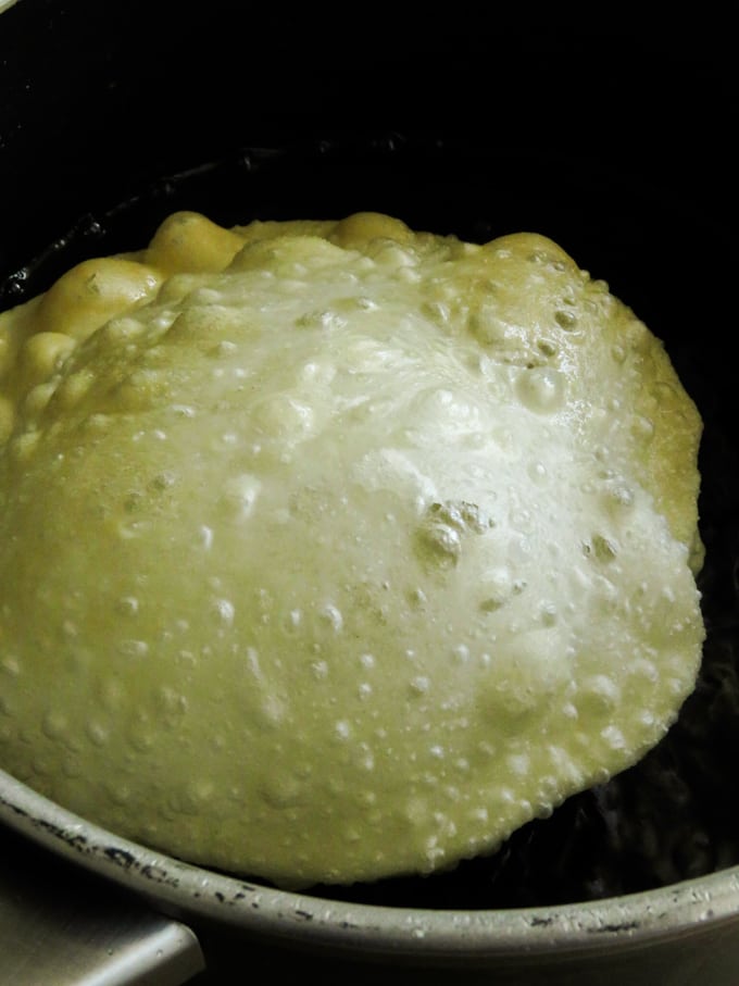 frying the poori .