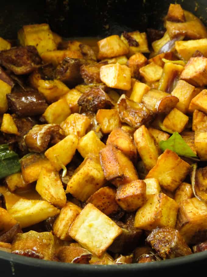 fried brinjals, ash plantain in pot.