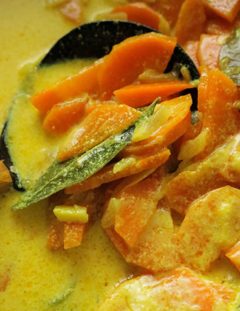 carrot coconut curry with curry leaves and spices