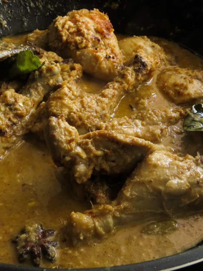 slow cooking the rendang chicken curry to reduce it